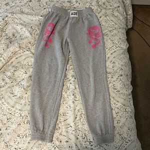 ADIKA Tokyo Sweatpants in size small. Grey with pink dragons. Selling for $28!